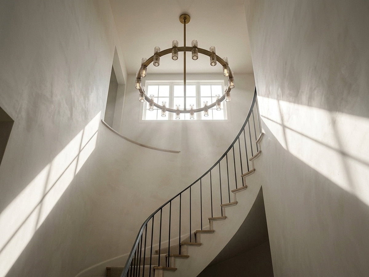 Ring chandelier at the top of a tall spiral stairwell