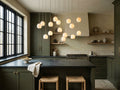Arica Linear Chandelier in an olive green kitchen